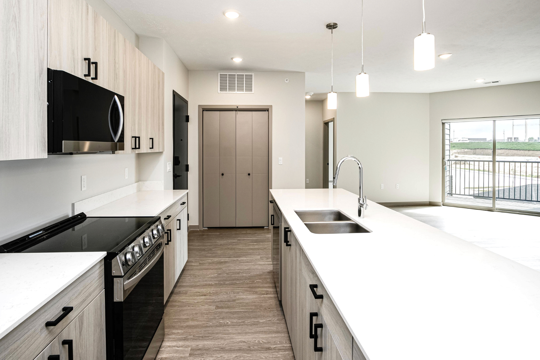 302 Kitchen with light cabinets and stainless steel appliances