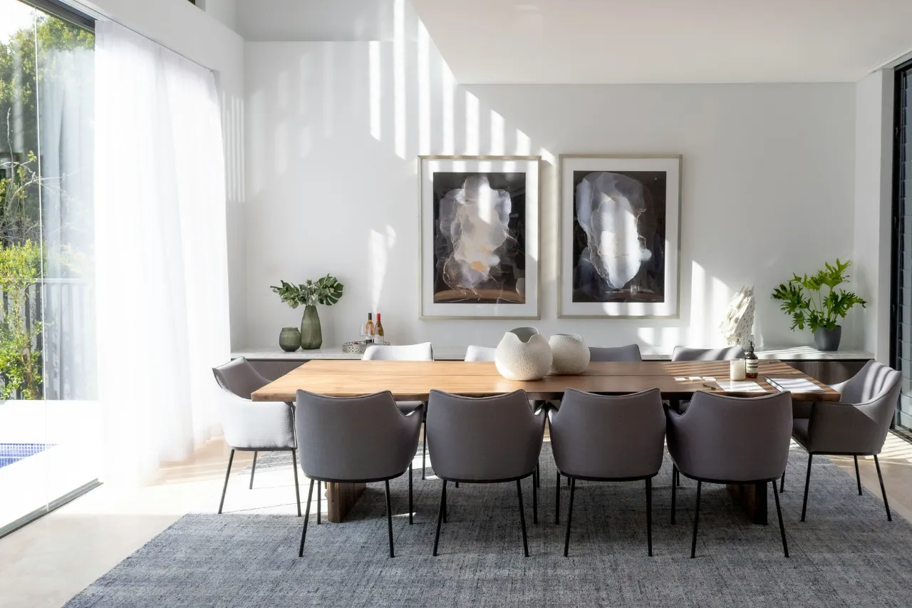 furnished kitchen with table and wall art stock image