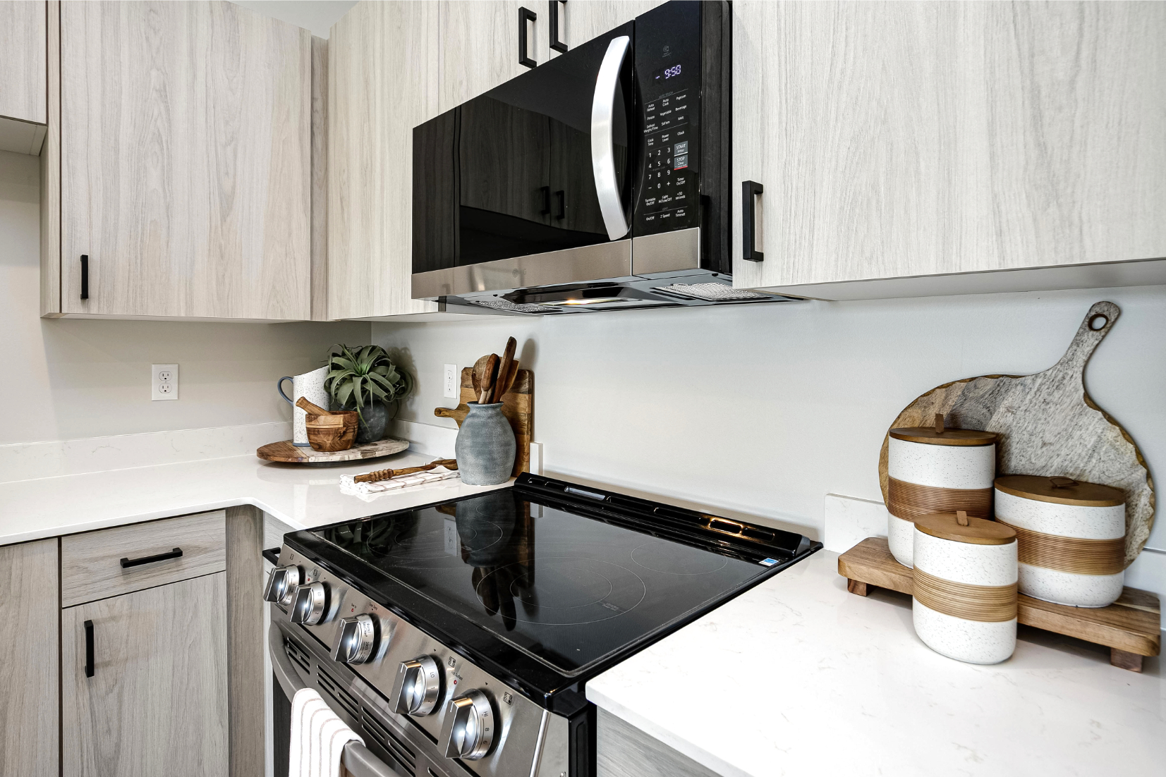 Kitchen with light wood cabinets and stainless steel appliances