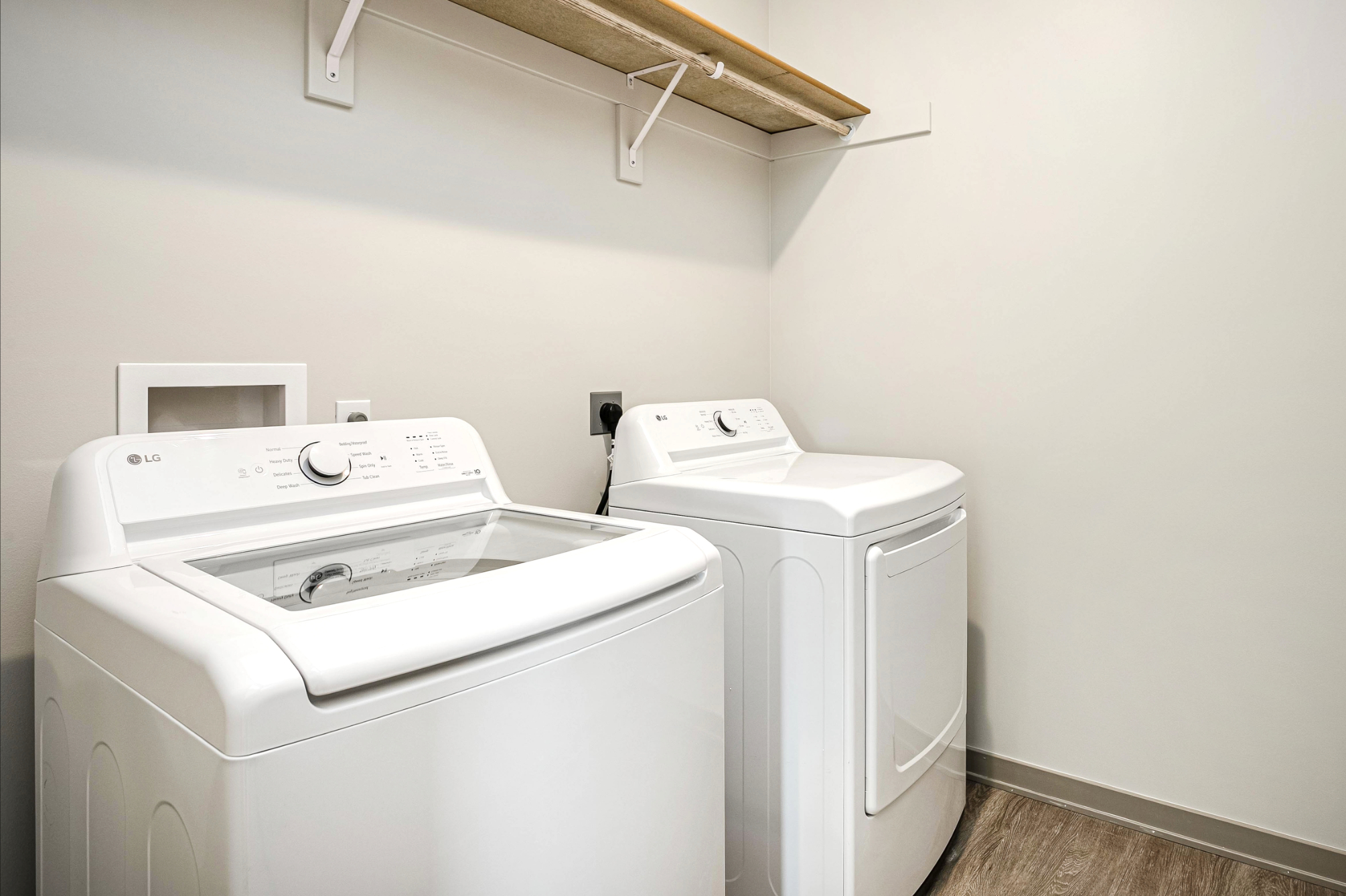 Laundry room with white appliances