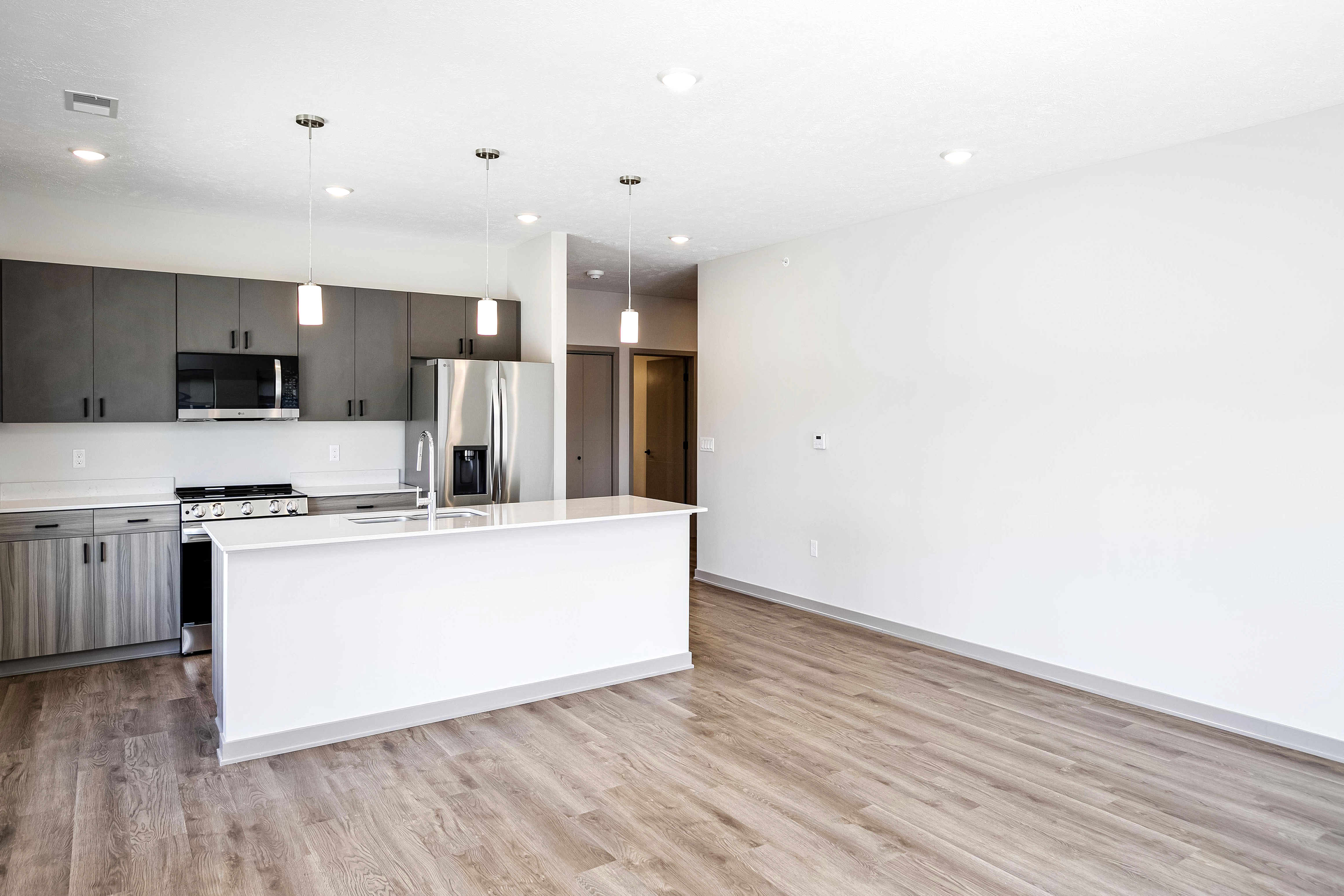 Living area and kitchen with island