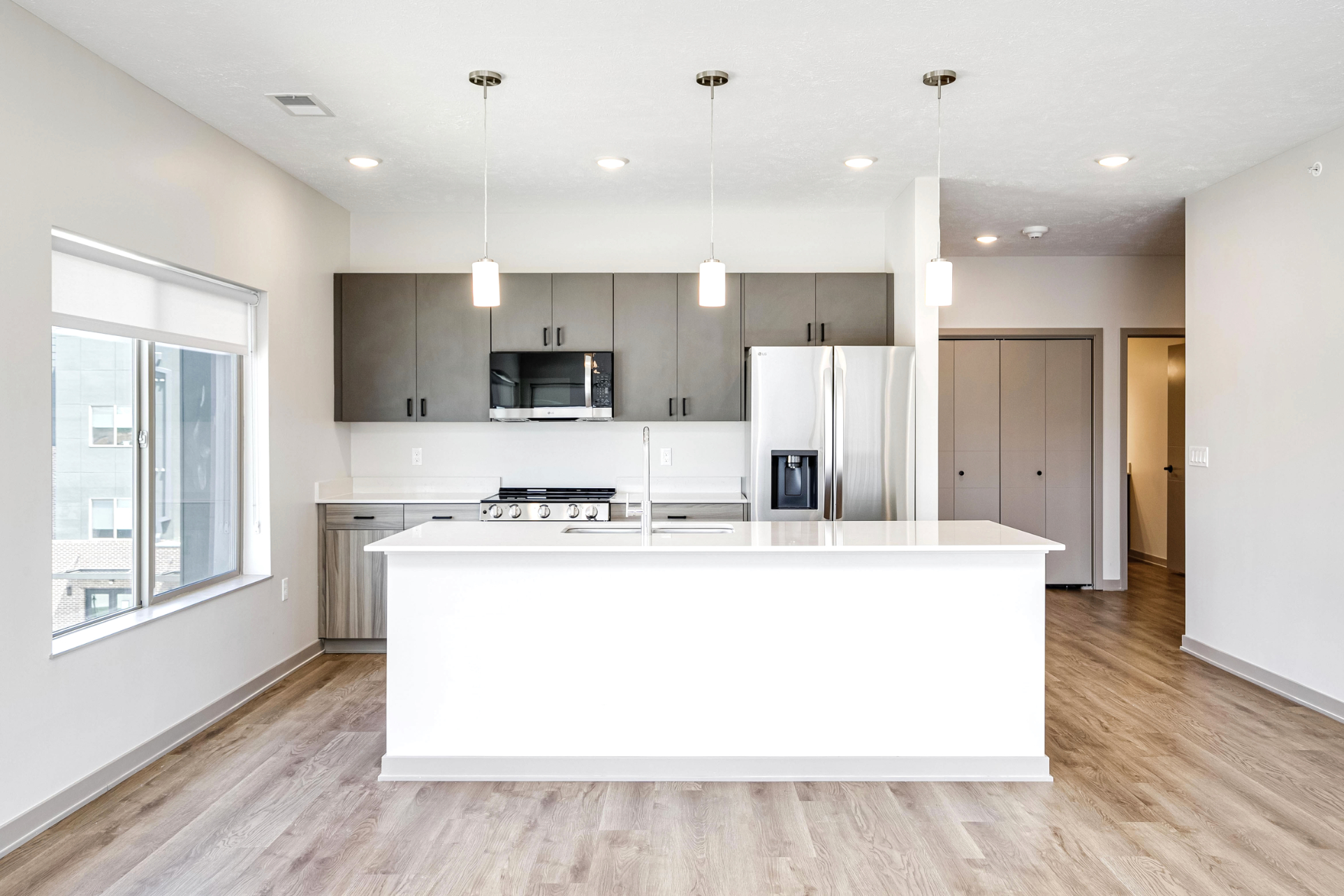 Living area and kitchen with island