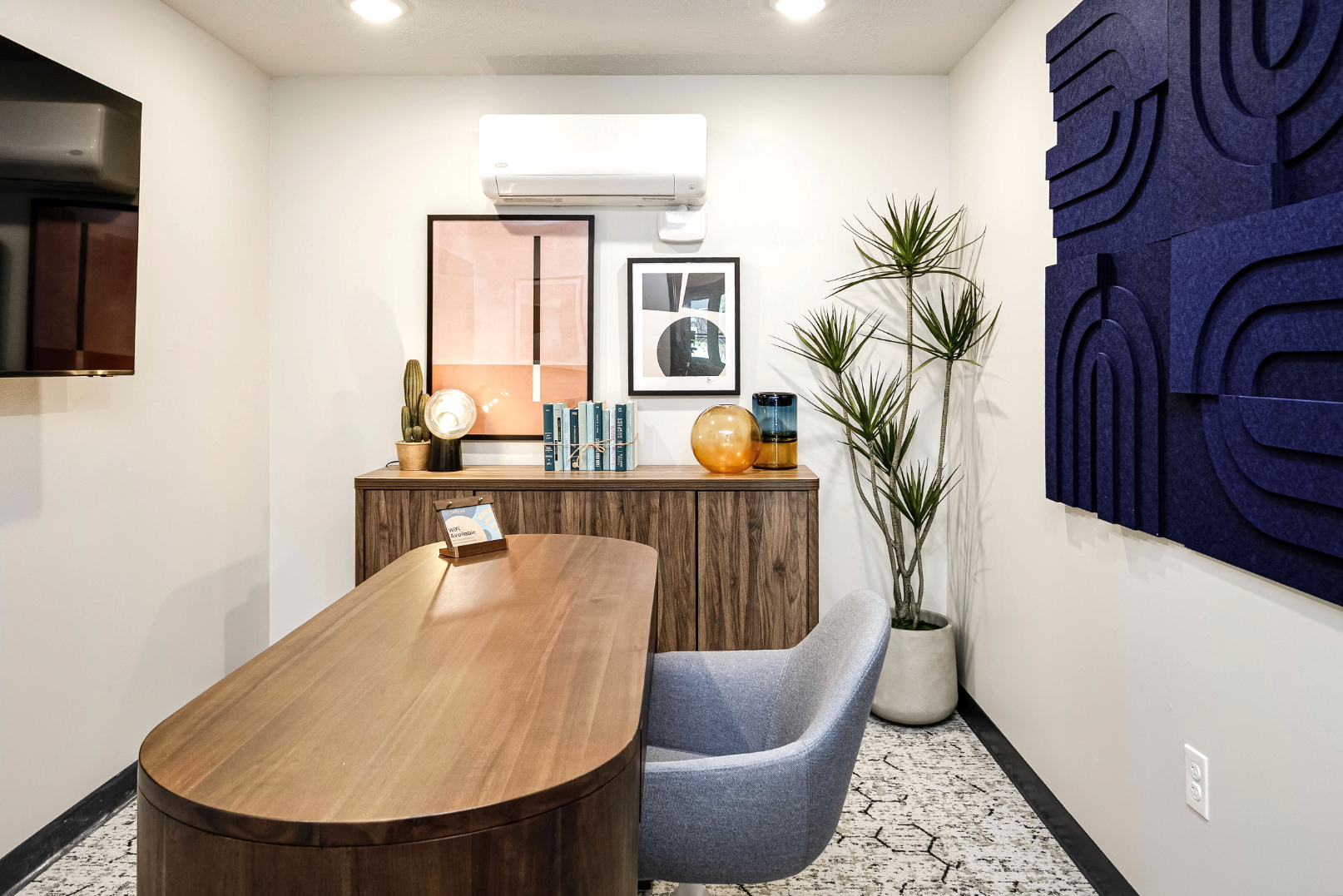 Clubhouse office with desk, chair, and tv