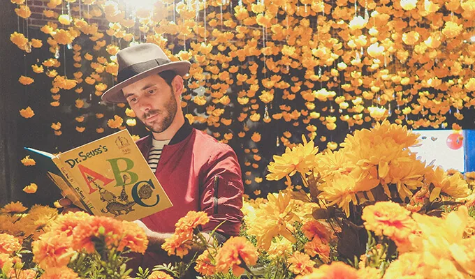 creativity blossoming man reading and flowers