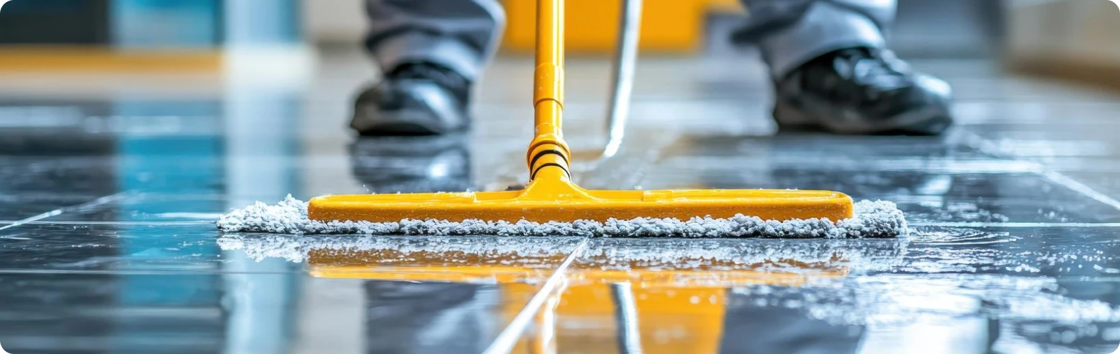 Living room with beige couch wrapped in plastic and multiple cardboard boxes stacked around and on a small table.