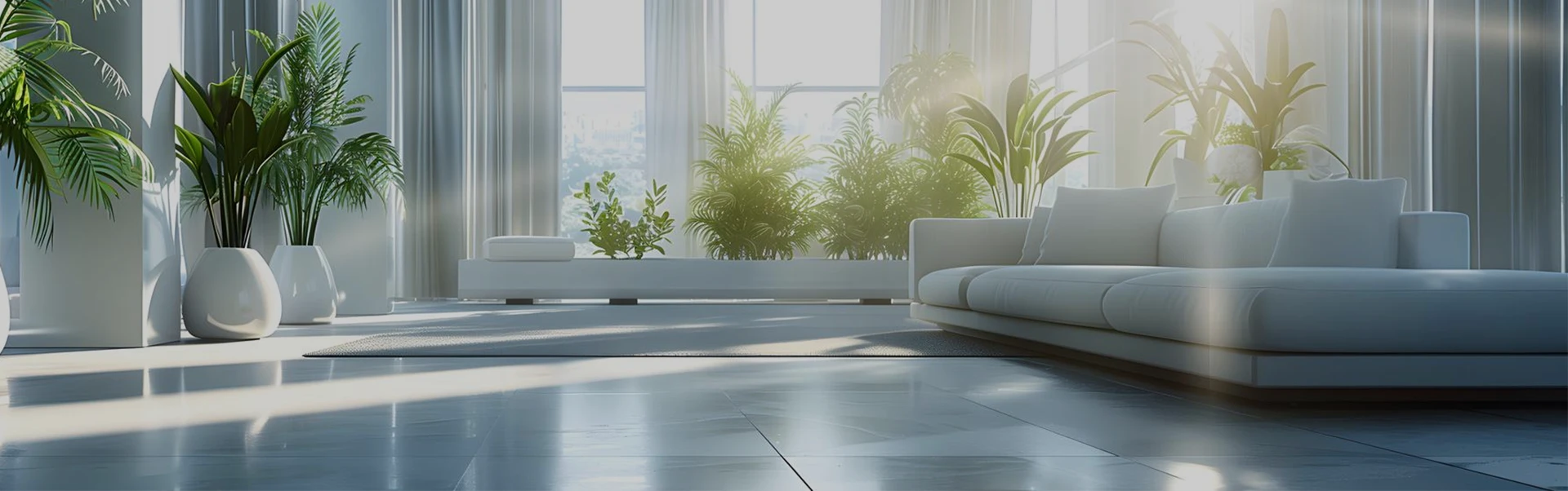 Bright modern living room with large windows, white sofa, and multiple potted green plants.