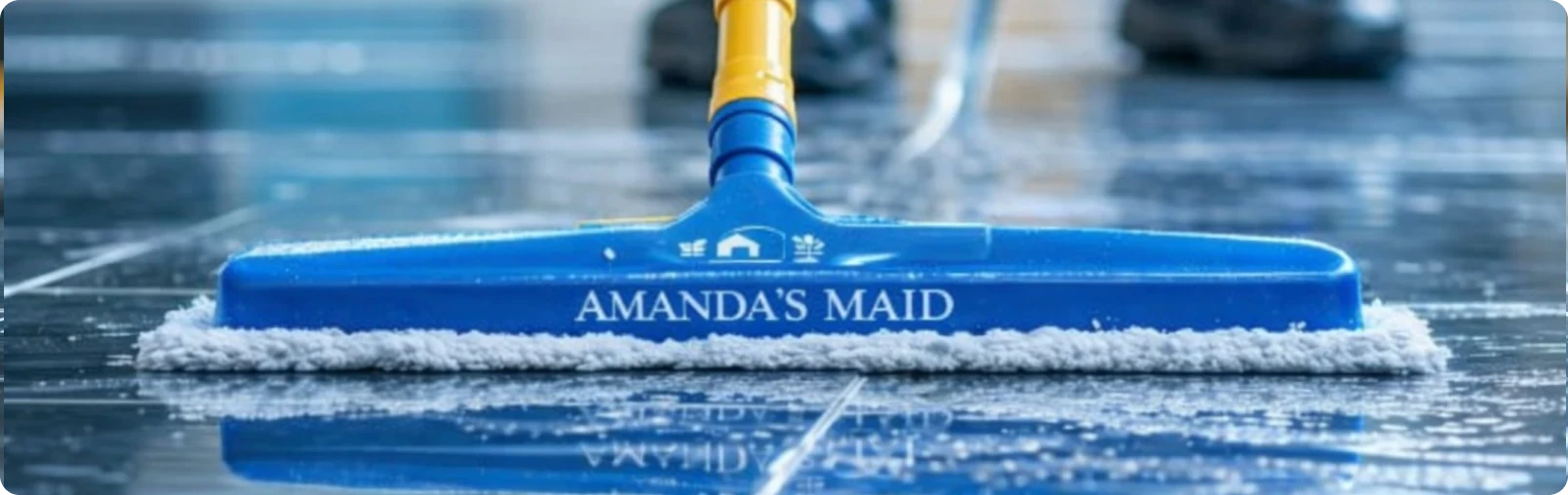 Living room with beige couch wrapped in plastic and multiple cardboard boxes stacked around and on a small table.