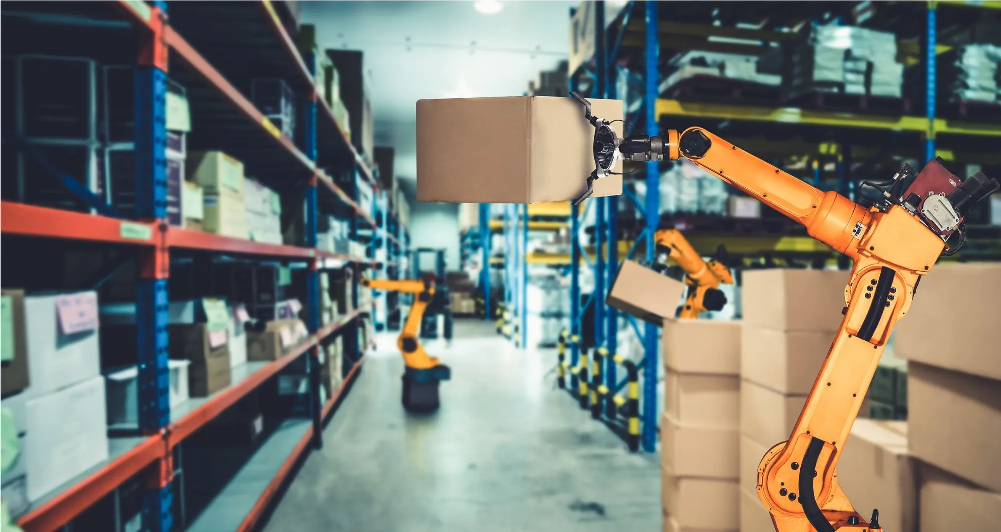 A robot efficiently moving boxes in a warehouse, showcasing AI's role in revolutionizing supply chain management.