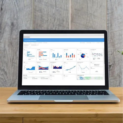 A laptop with a graph on the screen, illustrating performance improvements in a relocation management system and case management.