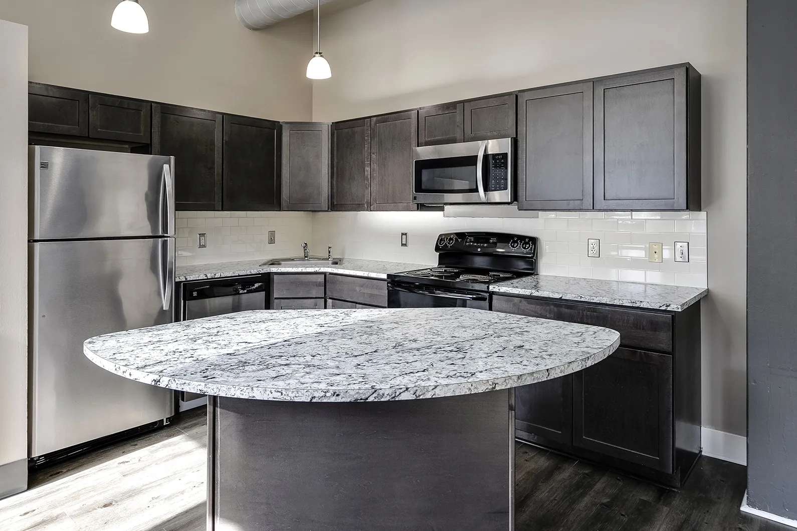 Kitchen with dark cabinets