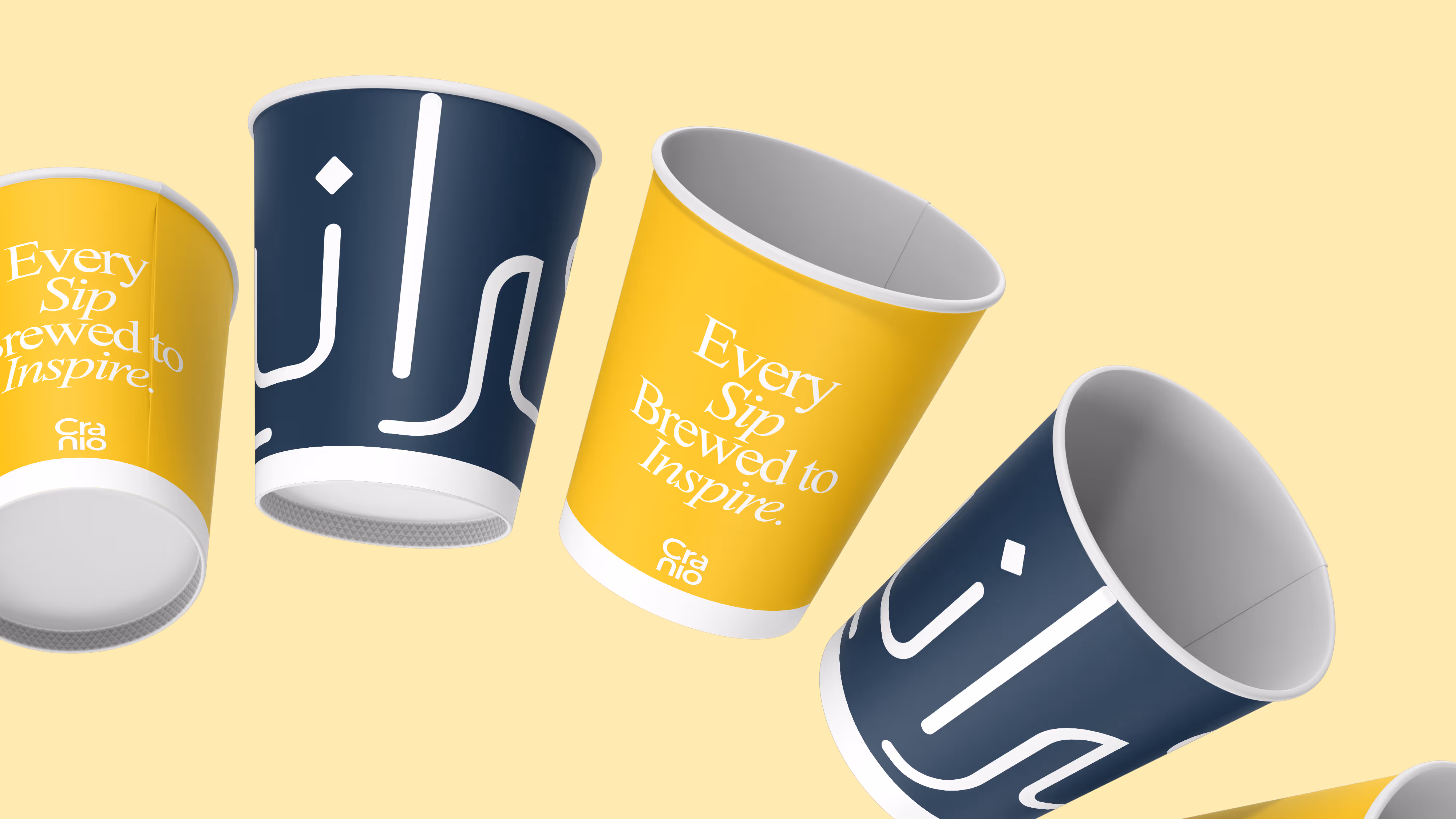 Cranio Specialty Cafe branded coffee cups with golden sunflower yellow identity in Doha