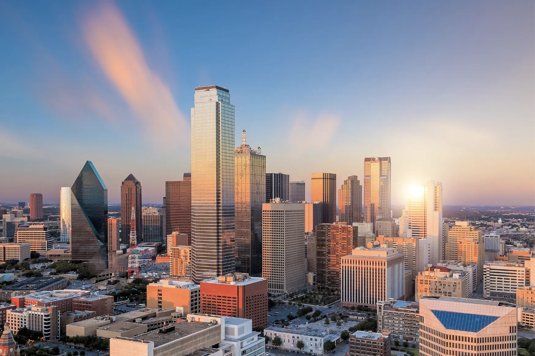 "Sunset over downtown Dallas skyline, a major hub for restaurants and hospitality businesses"