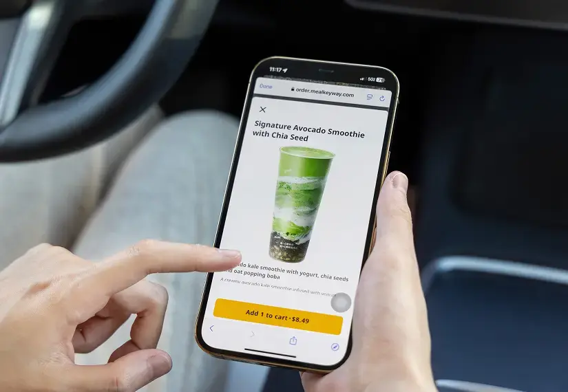 A customer using MenuSifu’s mobile ordering platform to order a Signature Avocado Smoothie with Chia Seed on their smartphone.