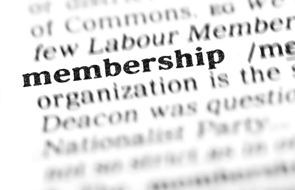 Close-up of the word “membership” highlighted in a printed dictionary or book page.