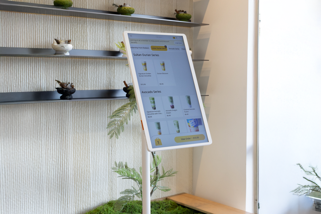 Sleek self-service kiosk featuring smooth menu navigation and modern hardware built for high performance in a busy cafe space.
