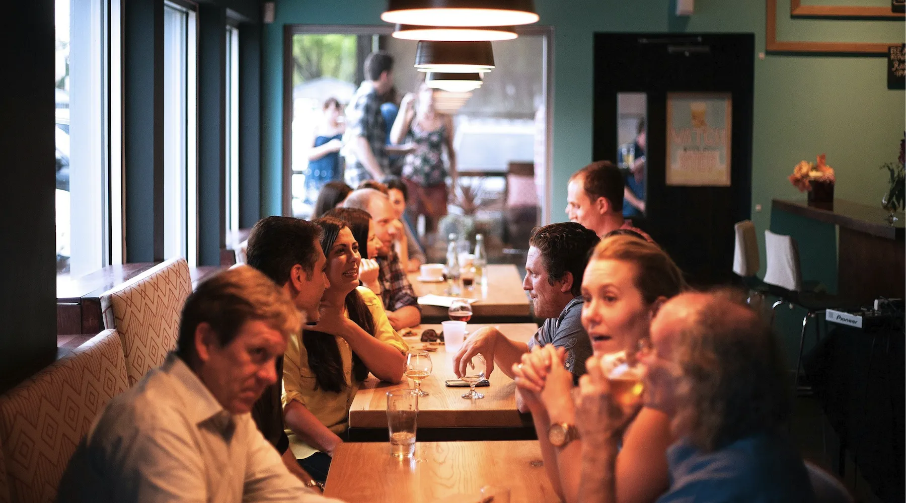 Customers dining at a busy restaurant