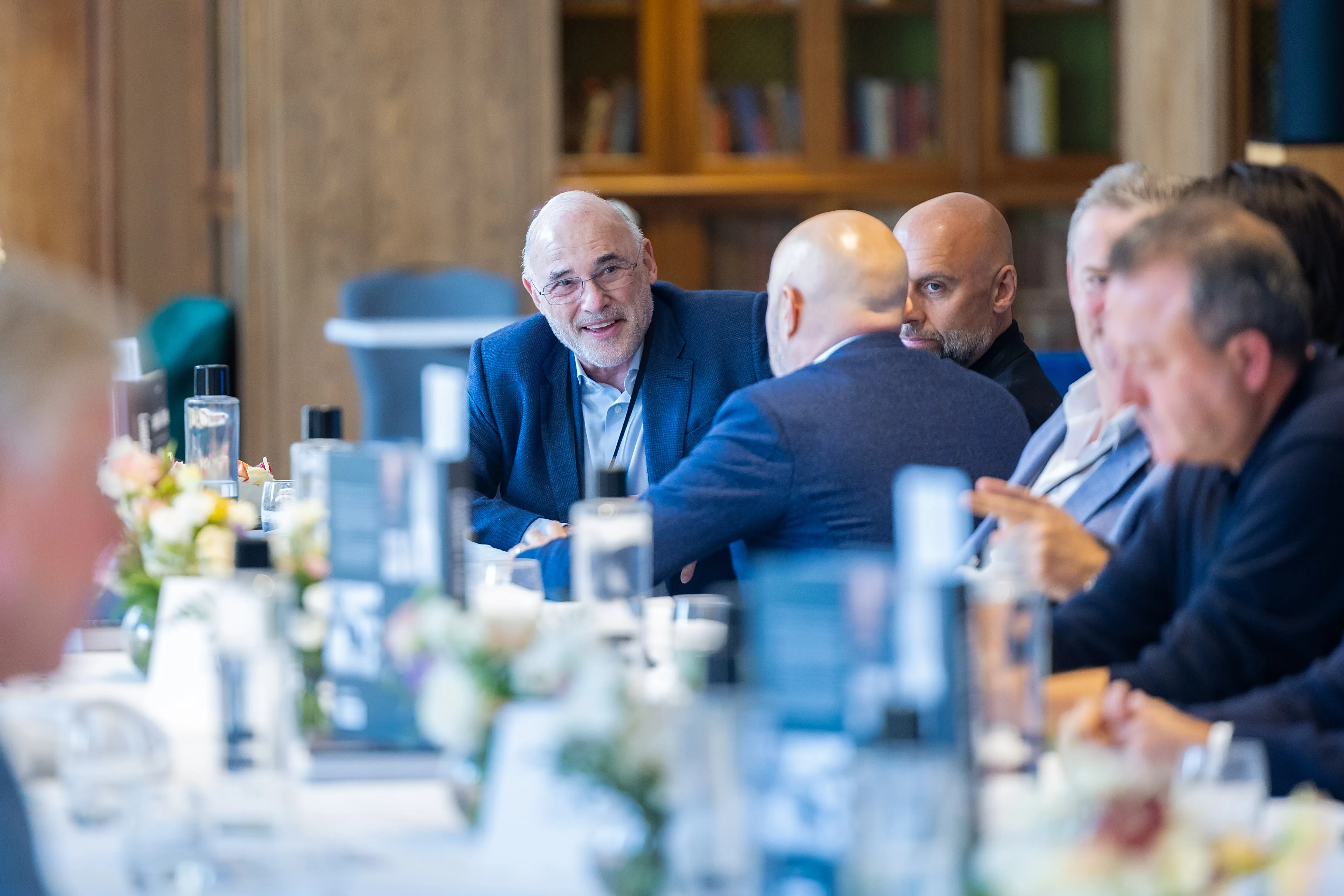Senior executives in discussion around a table at a Boardwave event, reflecting on the future and challenges of SaaS.