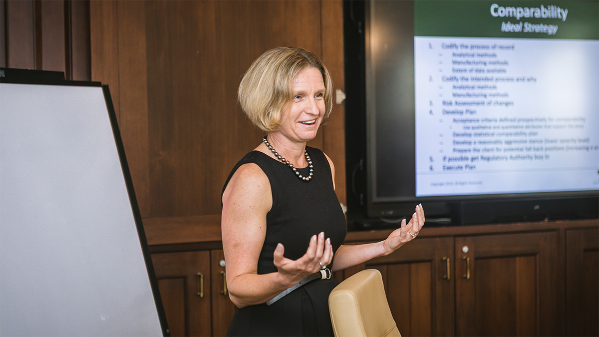 COO Katy Spink smiles and gestures