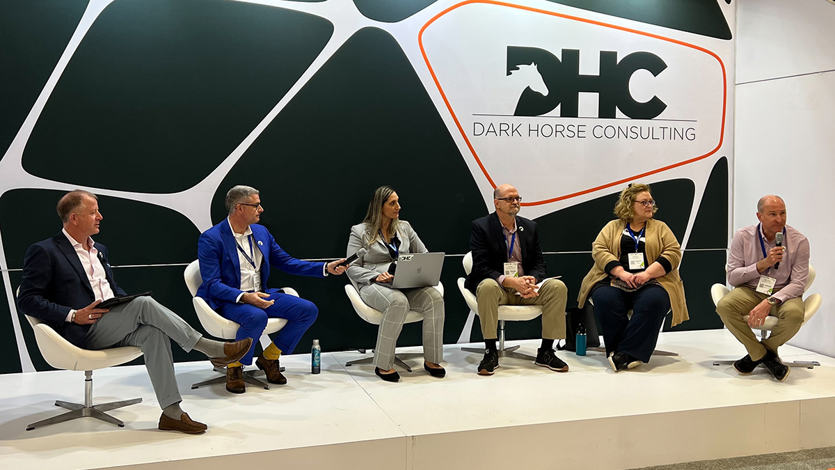 panel on stage with Dark Horse Consulting logo in the background