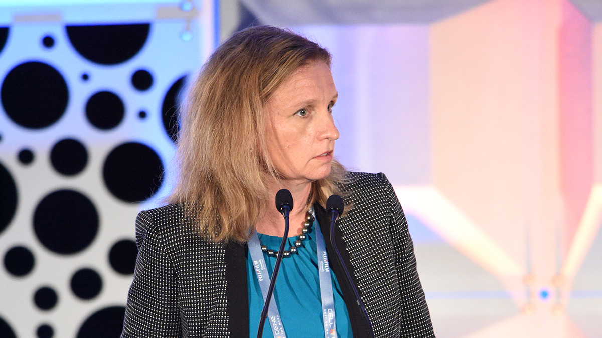 Katy standing behind a podium at Meeting on the Mesa