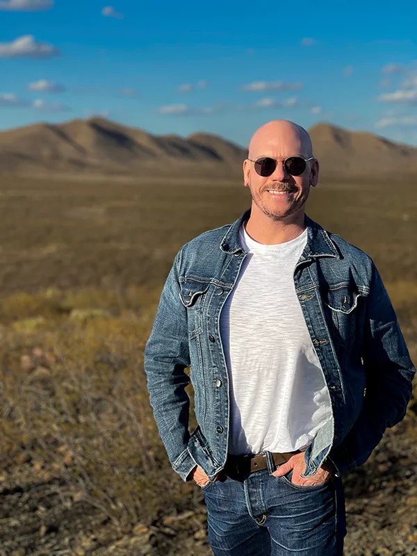 Tony Silva walking on a desert trail