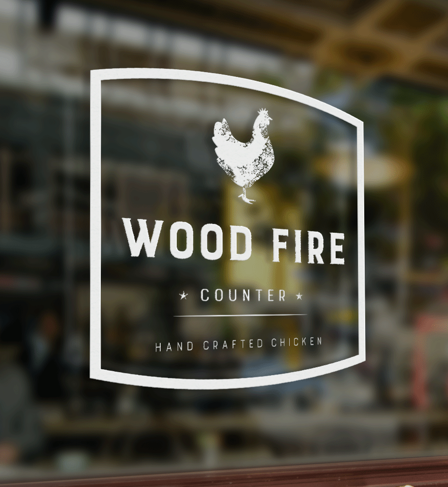 Woodfire Counter environmental design — branded window graphics with visual identity applied