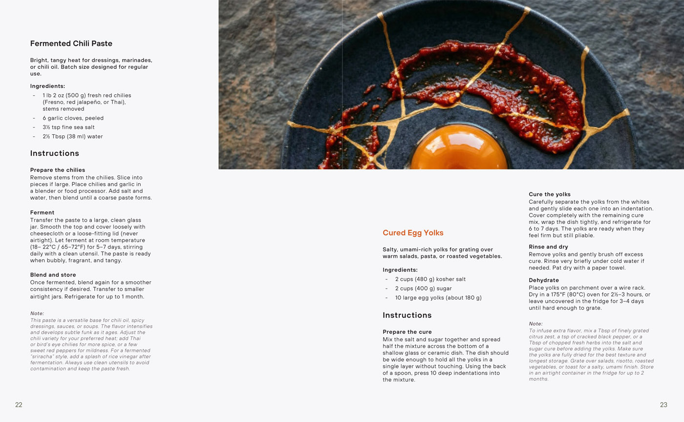 The Salad Manifesto recipe spread — overhead macro photography of chili and egg in cast iron pan