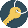 Close-up of a yellow key attached to a silver keyring on a dark blue background.