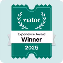 Viator Experience Award Winner 2025 badge in green with white text and laurel decoration.