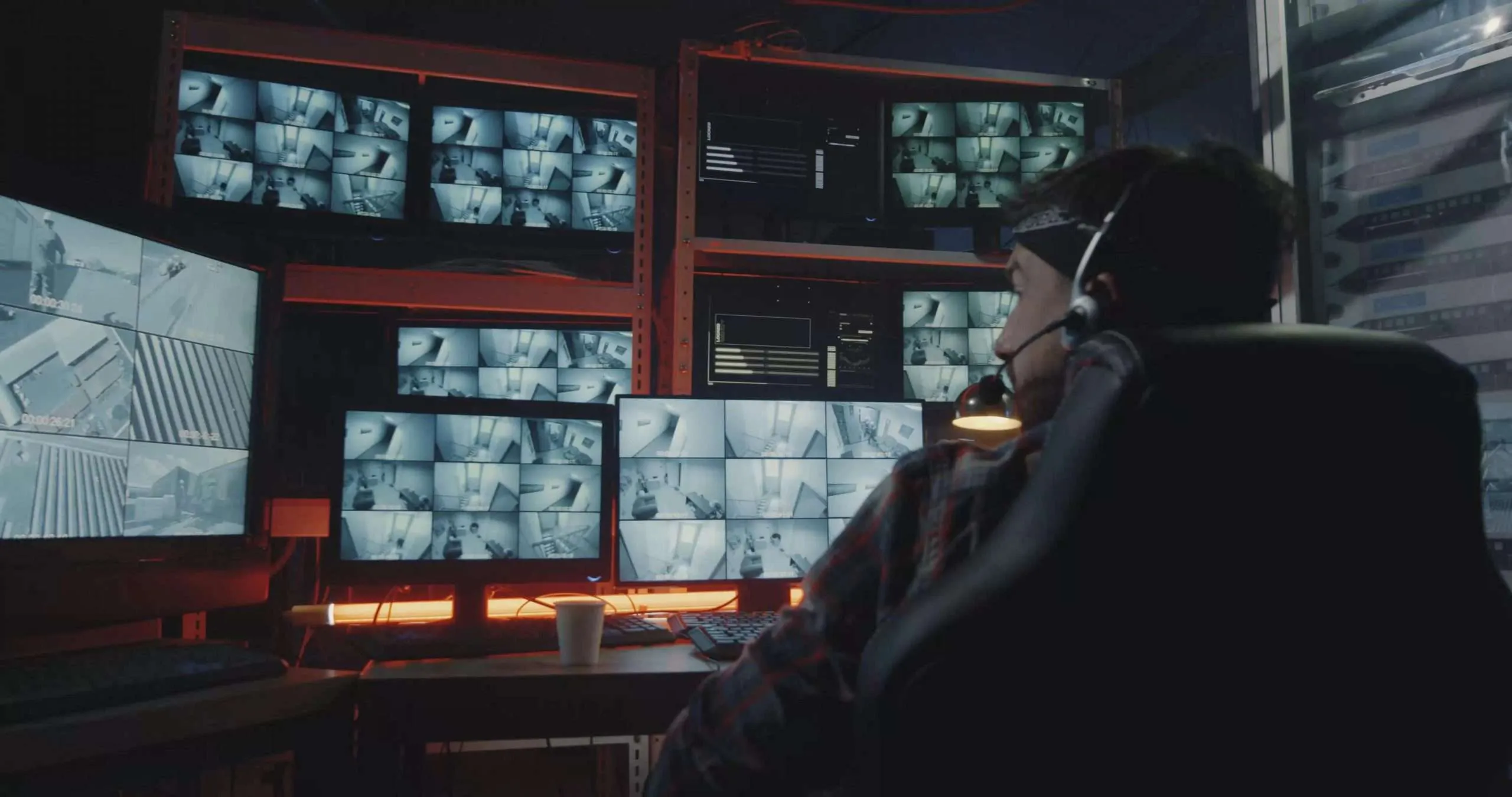 Security operator monitoring CCTV surveillance footage