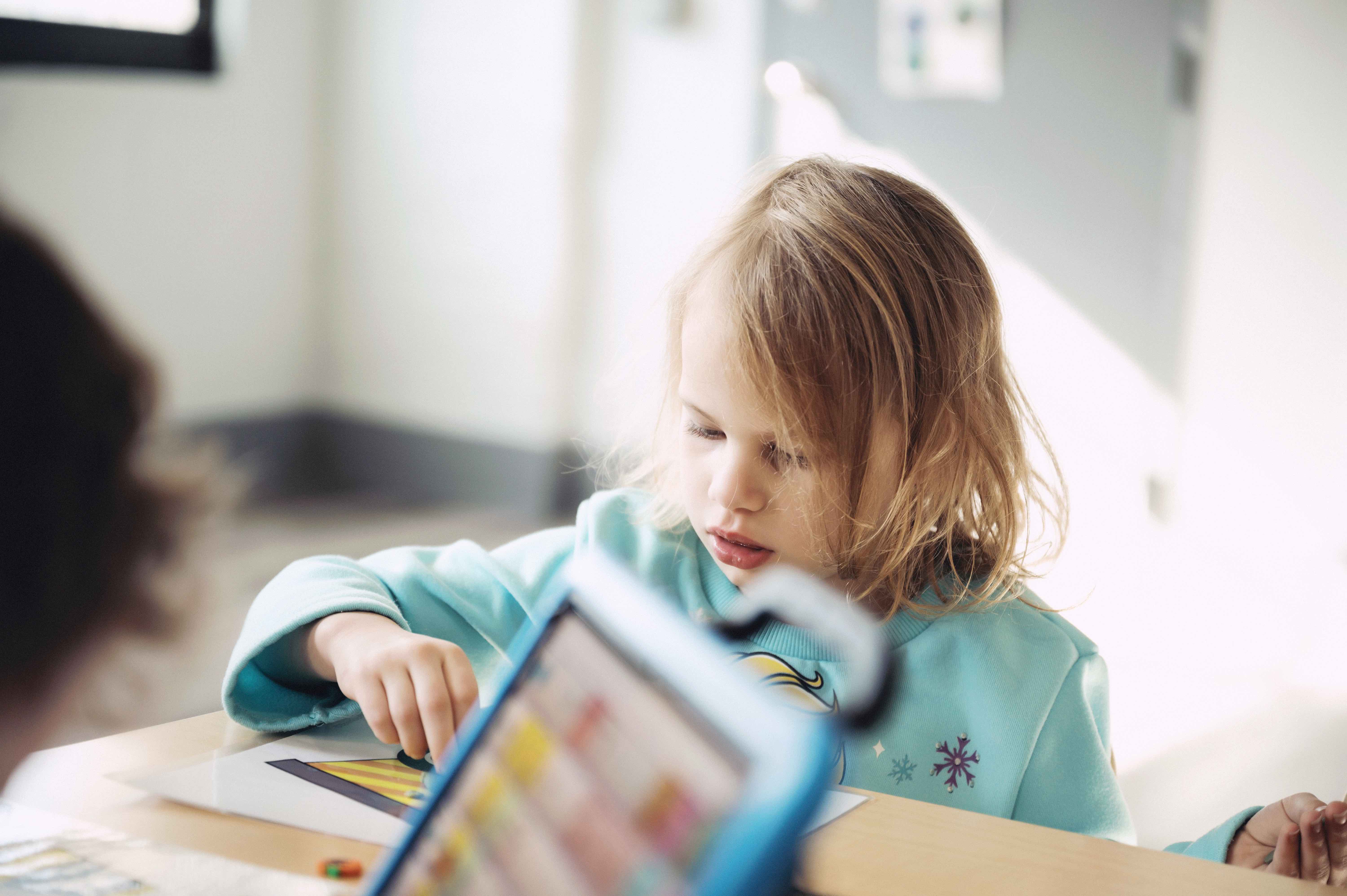 young patient color and playing with toys at Black Bear Academy in Chicago, Il