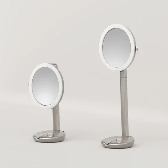 Two round tabletop mirrors with adjustable heights on a plain background.