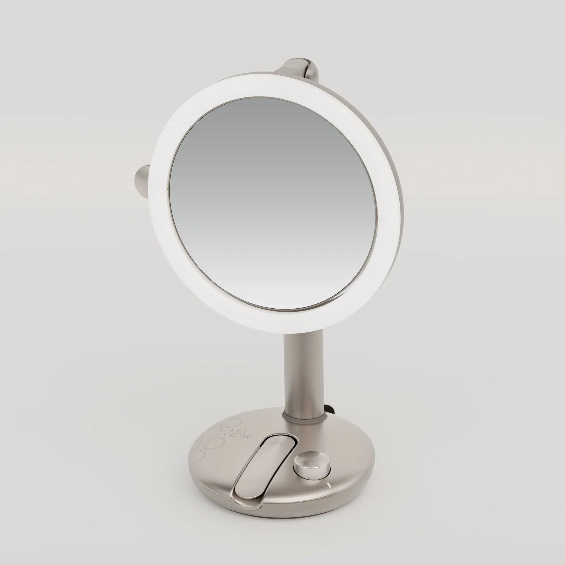 Round tabletop makeup mirror with built-in light and adjustable knob on a silver stand.