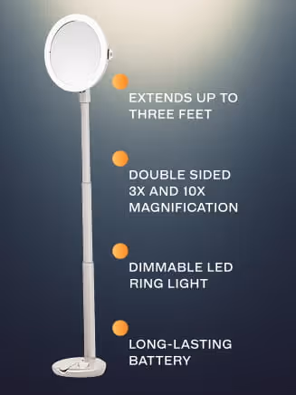 White standing double-sided mirror with extendable pole and included dimmable LED ring light, features extend up to three feet, 3x and 10x magnification, and long-lasting battery.