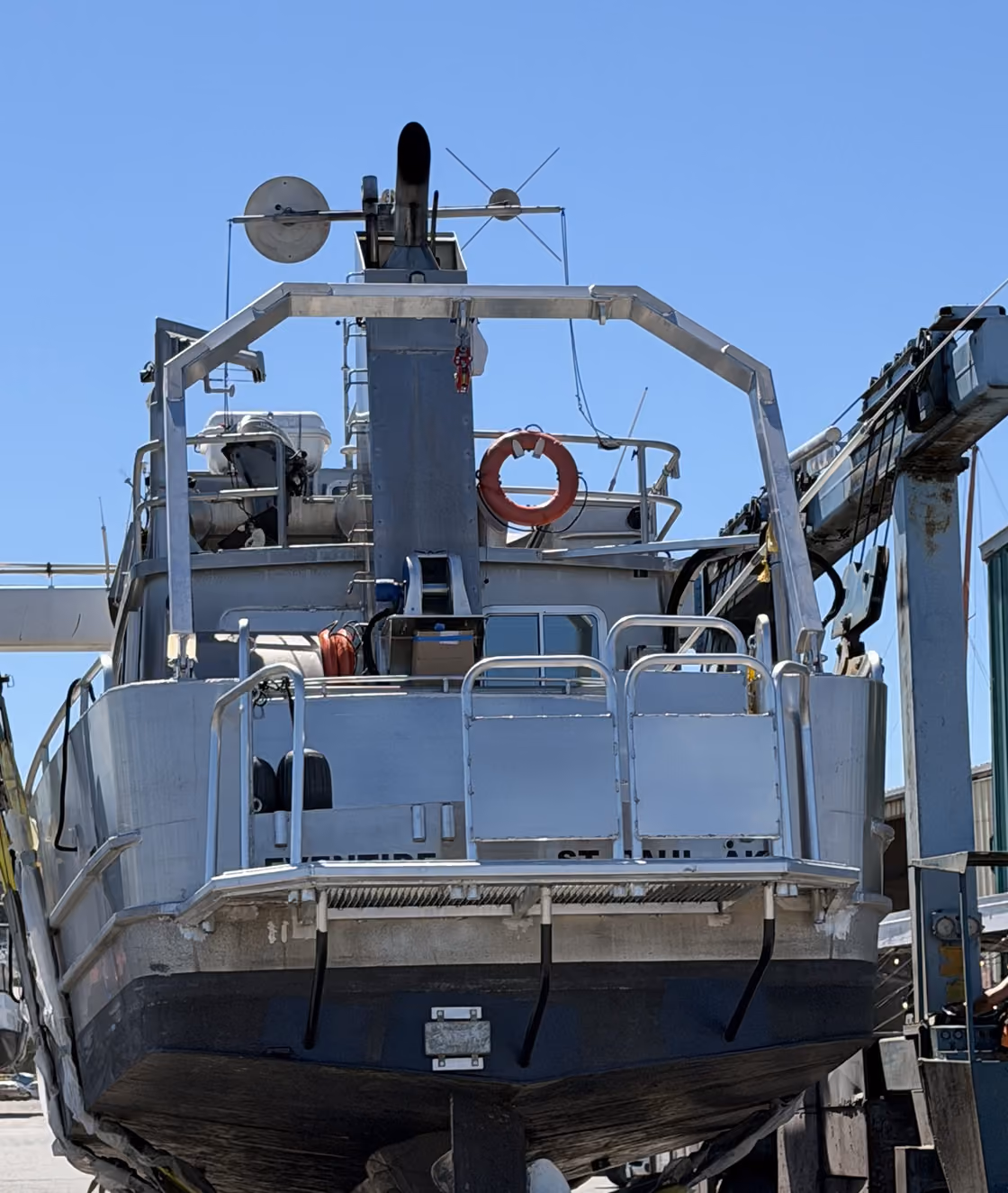 Stern of the research vessel Eventide showing its A-frame, deck railings and boarding platform