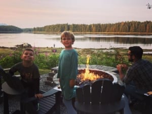 Photo of a Family Around a Campfire at Favorite Bay, One of the Best Alaska Fishing Resorts
