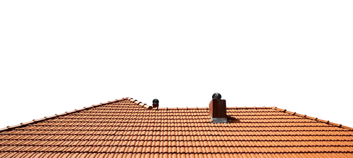 Red clay tiled rooftop with two metal ventilators under clear sky.