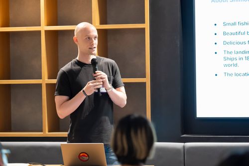 Maxwell Forrest speaking with microphone