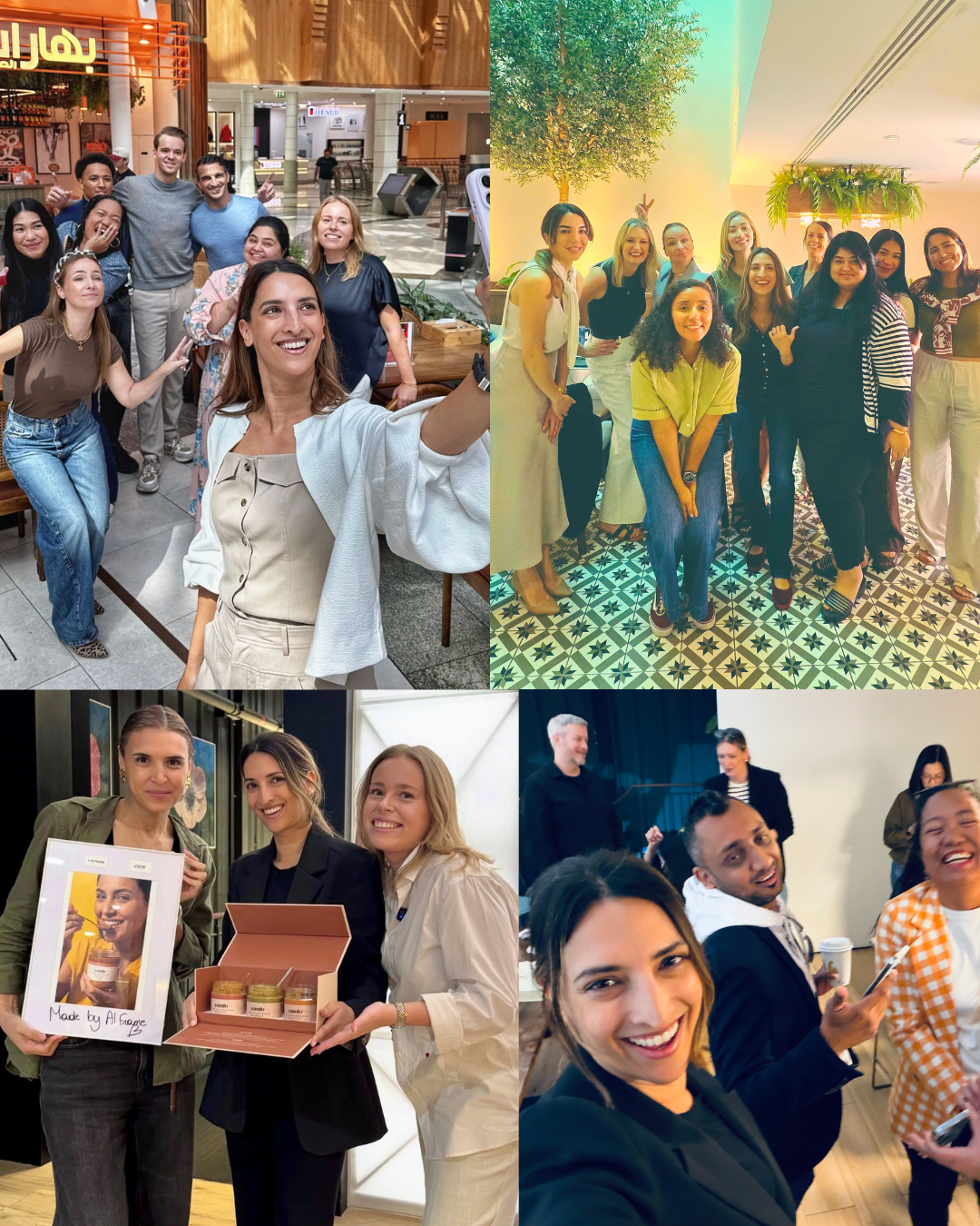 Group of ten smiling founders posing indoors in a cafe in Dubai on a patterned tile floor with plants hanging and a tree in the background.