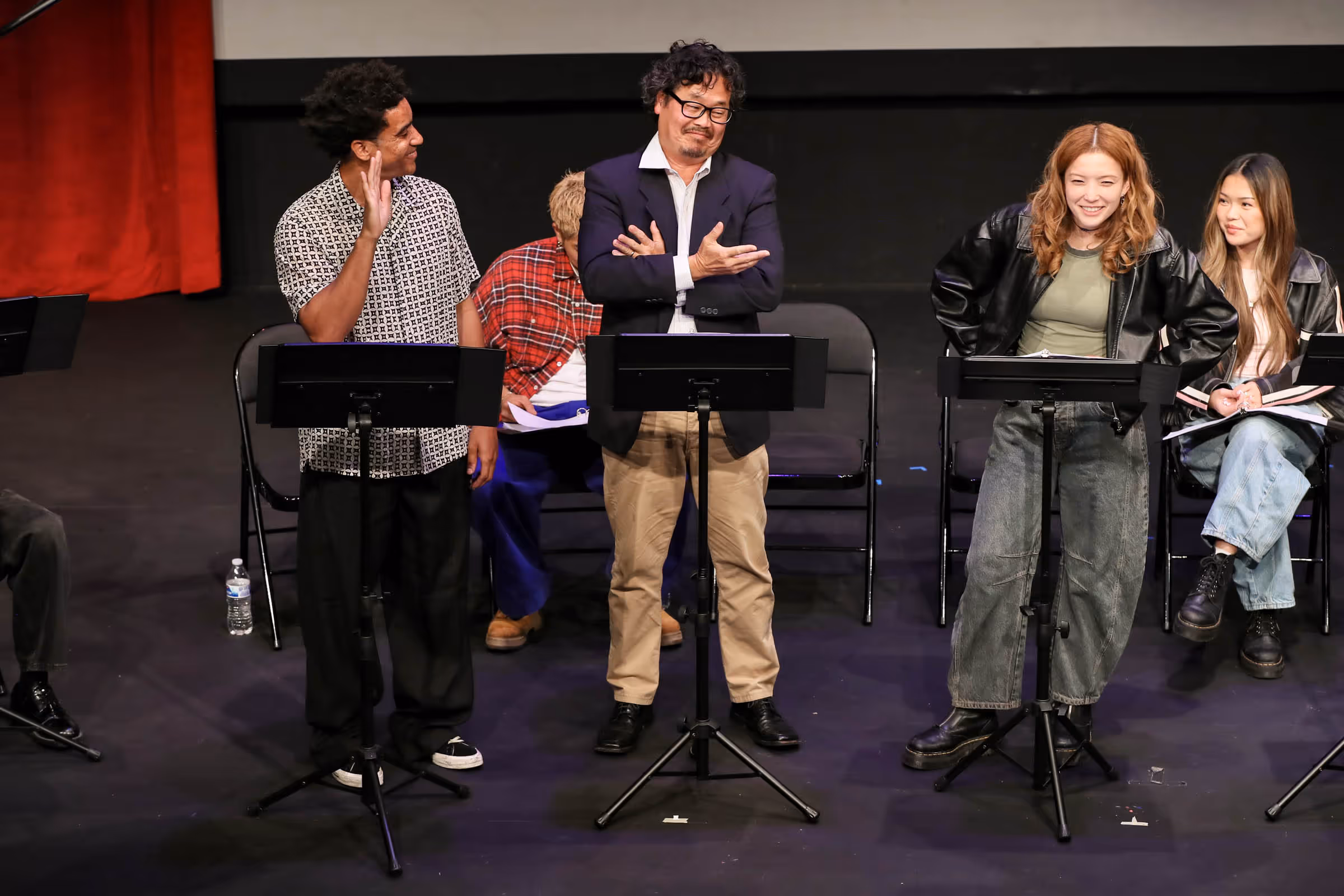 a group of people standing on a stage