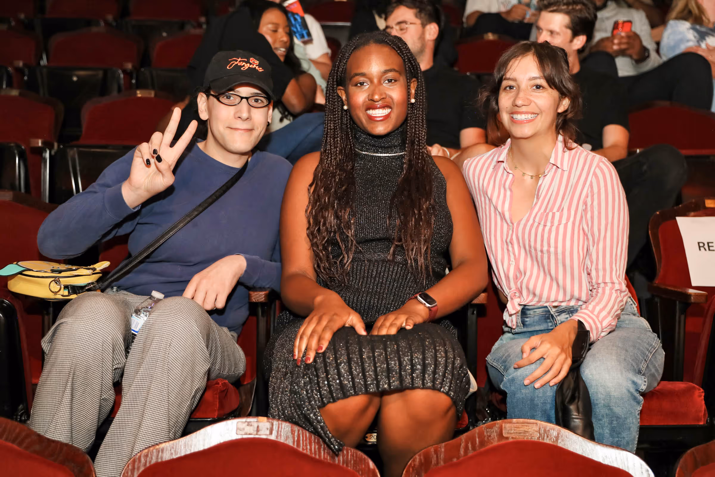 a group of people sitting in a theater