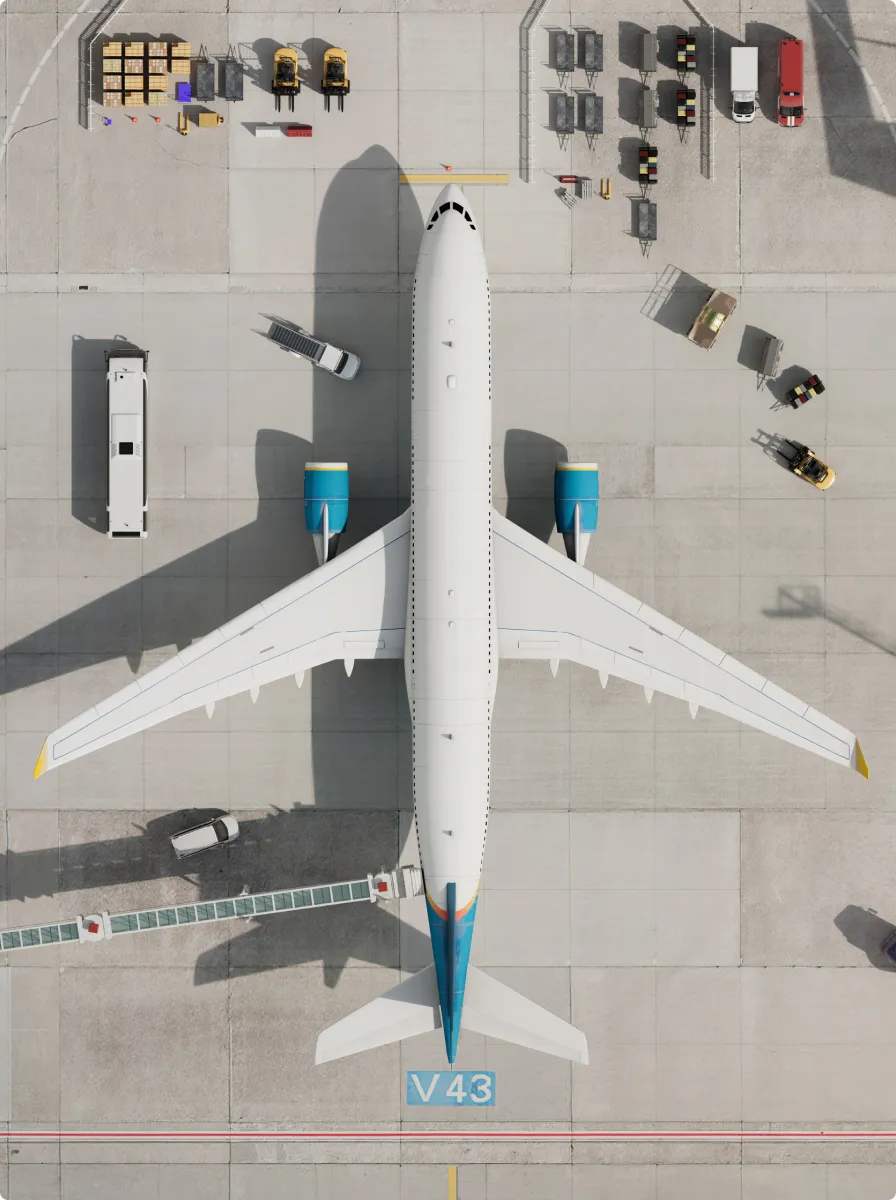 Aerial view of a white commercial airplane with blue engines parked on the tarmac near terminal gate V43 with ground service vehicles and equipment nearby.