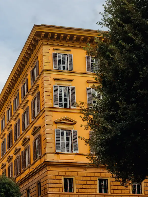 Classic yellow facade of Hotel Experimental Infante Sagres in Porto.