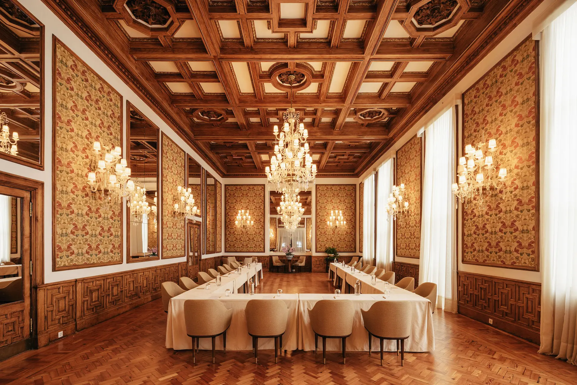 Elegant conference room with wooden coffered ceilings at Hotel Experimental Infante Sagres in Porto.