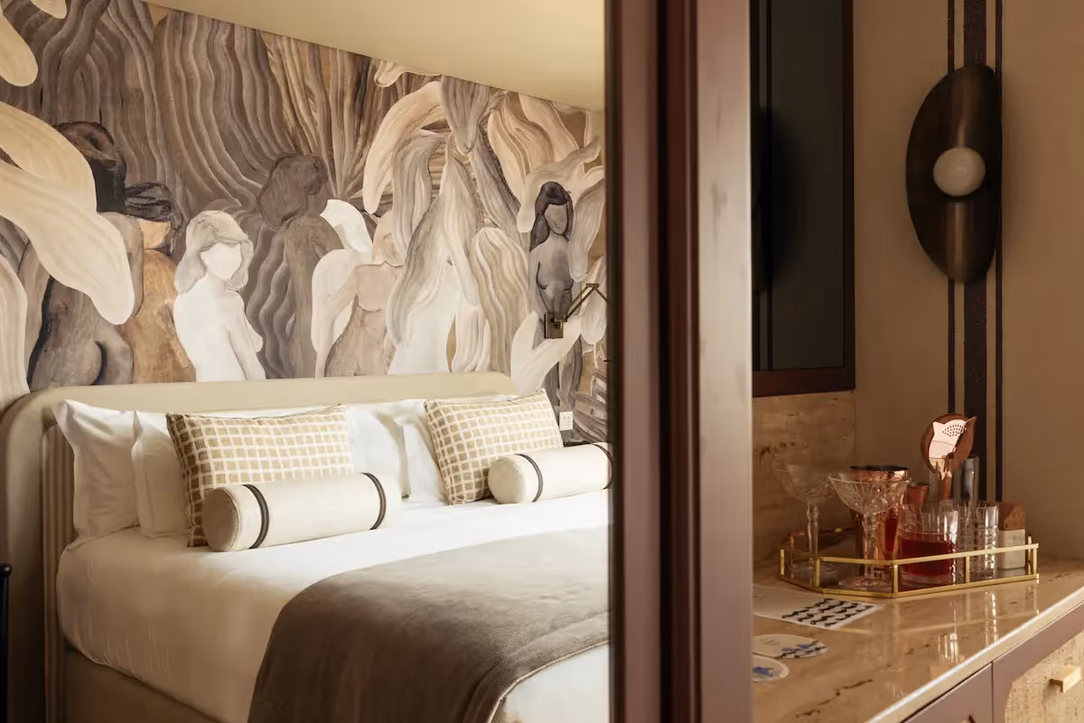 Artistic wall decor and chic minibar area at Hotel Experimental Infante Sagres in Porto.