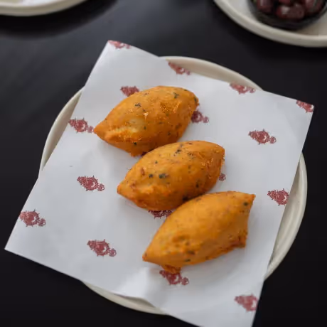 Trio of traditional Portuguese codfish fritters served at the Hotel Experimental Infante Sagres restaurant
