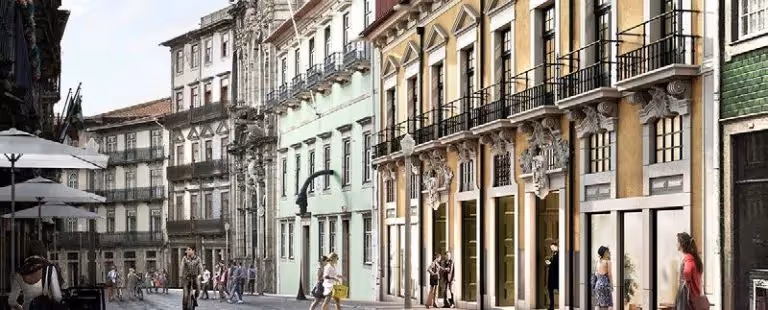 Elegant exterior facade and historic architecture of the Hotel Experimental Infante Sagres in Porto, located on a typical city center street.