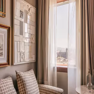 Detail of wall art and window with sheer curtains, Hotel Experimental Infante Sagres in Porto.