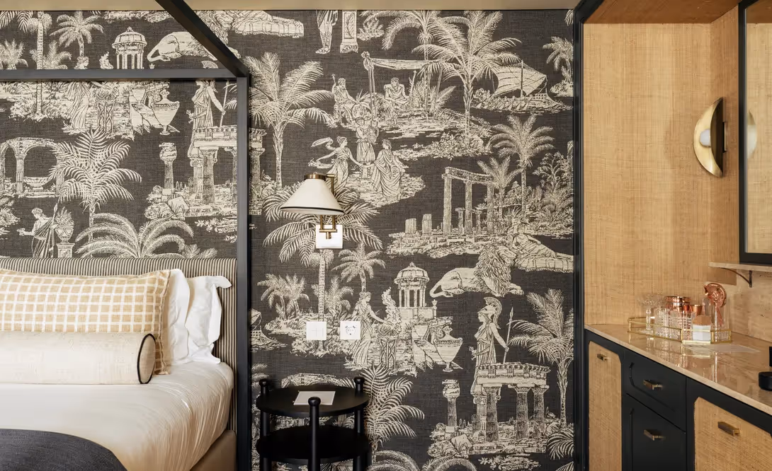 Detail of a headboard with scenic wallpaper depicting ancient scenes at the Hotel Experimental Infante Sagres in Porto.