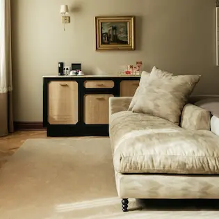 Relaxation area with an elegant chaise longue and designer furniture at Hotel Experimental Infante Sagres in Porto.